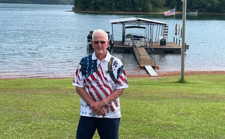 Hartwell staple Vinson Brown stands in front of his pristine lake front property in Hartwell.