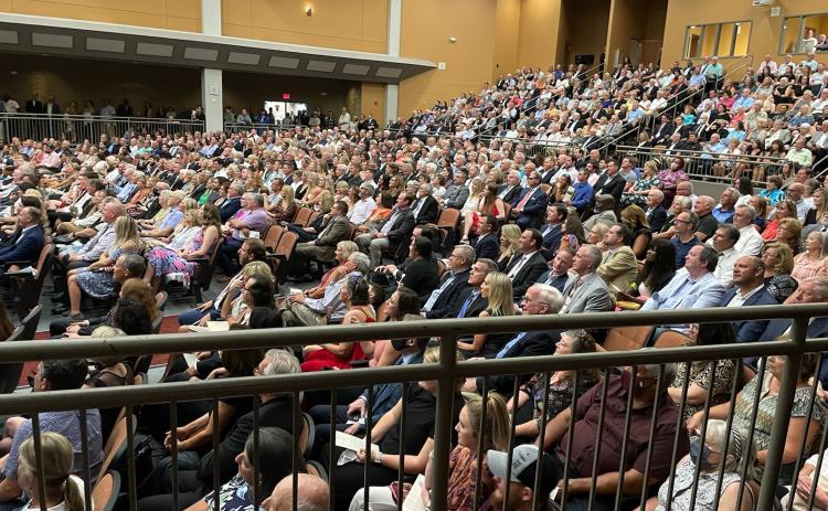 Hundreds of mourners gathered Sunday to honor the memory of Charly and Kelli Schell at the Lonnie Burns Fine Arts Center.