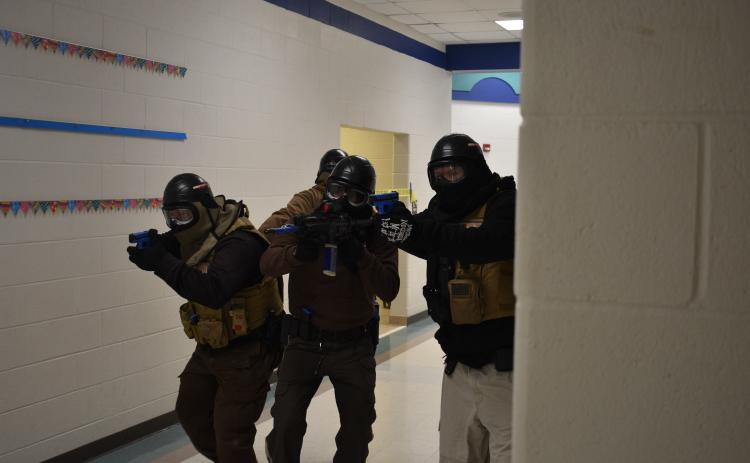The active shooter training team simulates an active shooter situation. Pictured above, the “good guys” in one of the scenarios.