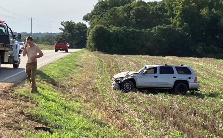 The driver in a single-car accident Tuesday along Lavonia Highway walks from his car uninjured.
