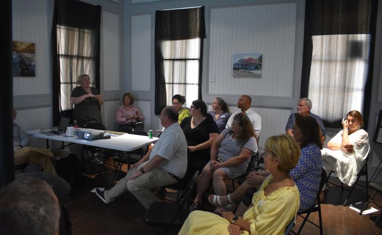 Several community members attend a meeting with the National Main Street program on Wednesday, Aug. 10 at the Hartwell Train Depot.