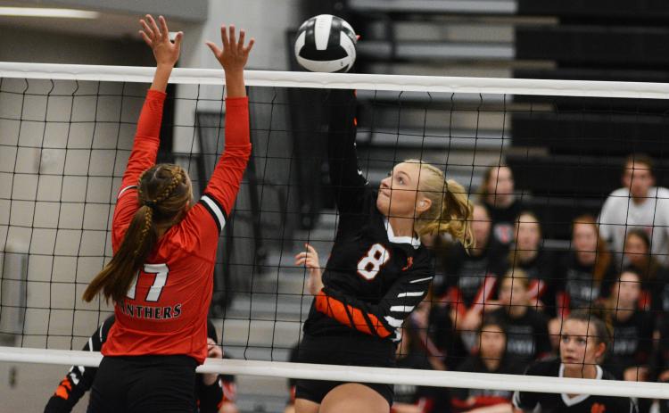 Cali Beebe goes for the kill against Jackson County on Aug. 18.