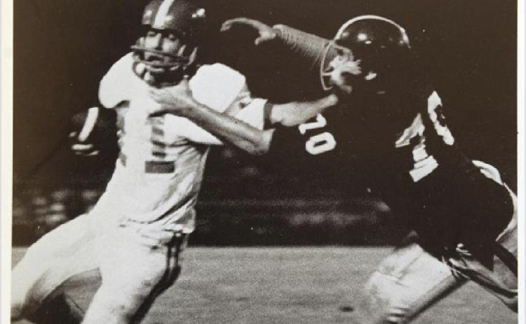 A newspaper clipping of Tash Van Dora as quarterback for Glynn Academy.
