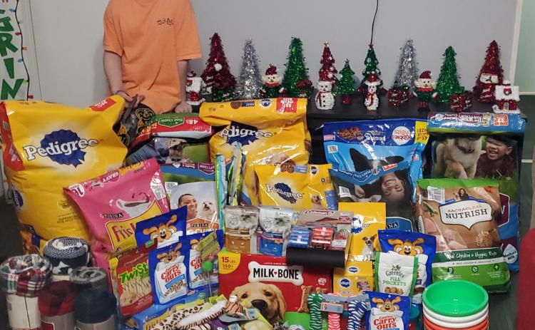 After requesting supplies for the Northeast Georgia Animal Shelter as ninth birthday gifts, Asher Lack donates a haul of items.