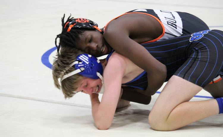 Hart County wrestler Carlveon Cheeks takes on an Oconee County opponent in a match.