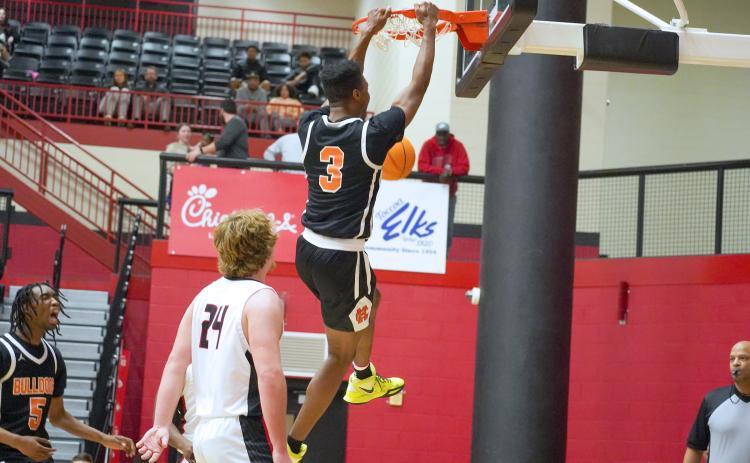Senior forward Tahj Johnson slams it home in the 67-62 road win over Stephens County.