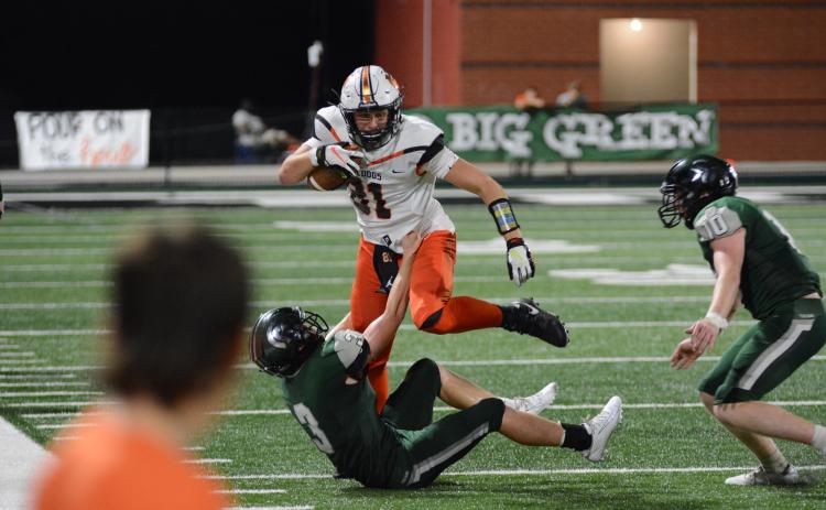 Former HCHS tight end Cane Berrong shedding a tackle against North Hall in 2020.