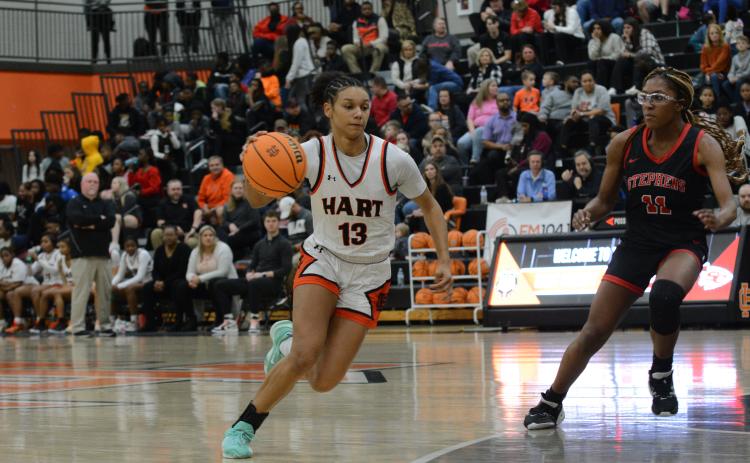 Junior guard Alexis Walker drives into the lane in the 50-23 home win over the Stephens County Lady Indians on Feb. 3.