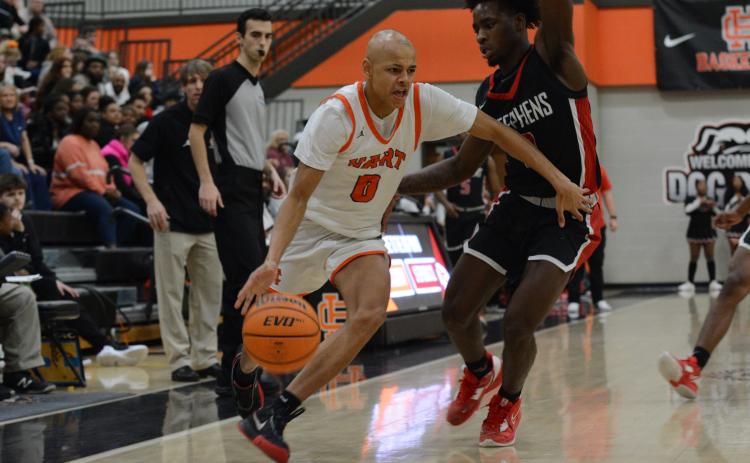 Sophomore guard Keelan Stowers fights off a defender in the 69-62 home win over the Stephens County Indians.