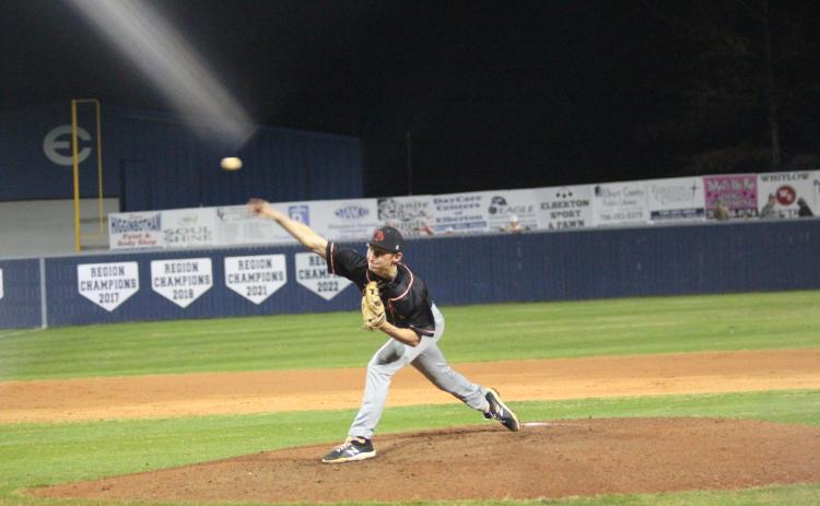 Senior pitcher Reece Maxwell delivers a pitch in the 9-4 road loss to Elbert County  in the season opener on Feb. 8. (Photo by Mark Wells at The Elberton Star)