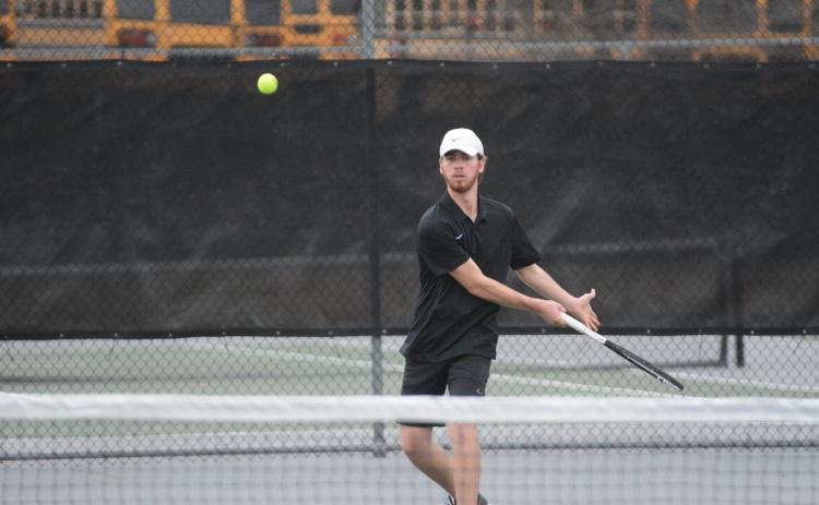 Senior Daniel Leard returns a serve in a 2022 match as the Lady Dogs start 1-0 and the Dogs start 0-1 on the season.