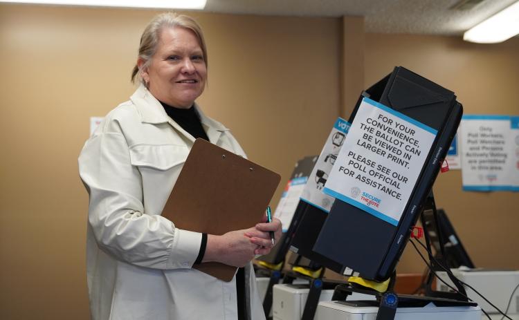 Hart County Elections Coordinator Robin Webb inspects one of the voting machines on Monday, as she finished the final preparations before Election Day on Tuesday.