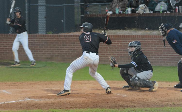 Pictured is senior catcher Riley Posey as he picked up an RBI single in the sixth inning to propel the Dogs to a 10-5 win over Oconee County on Tuesday.