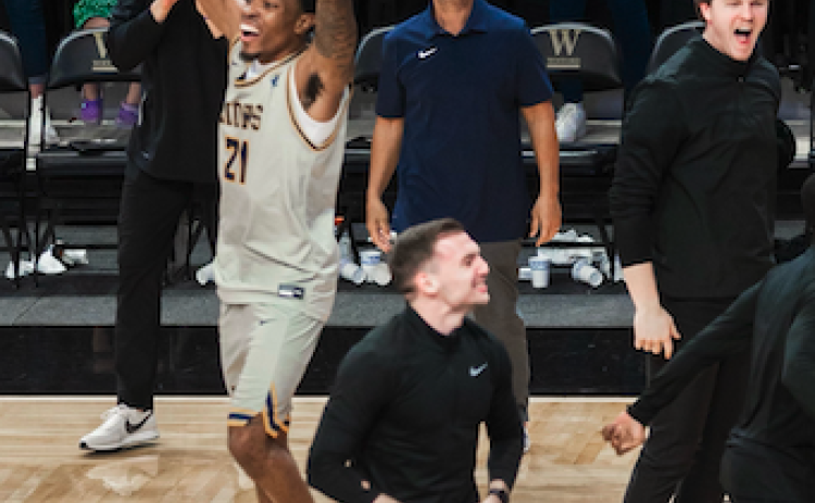 Pictured left is Shone Webb with Ben Edwards pictured right celebrating after Emmanuel College wins the Conference of Carolinas championship on Sunday.