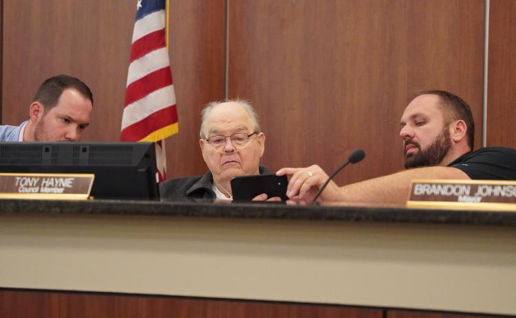 Hartwell City Council members (from left) Dan Leard, Tony Haynie and Mayor Brandon Johnson take a first look at the proposed MLK mural to go downtown off Franklin Street. The council decided to approve funding for a mural, but asked for changes to be made to the original proposed design and would require council approval of the design before moving forward.