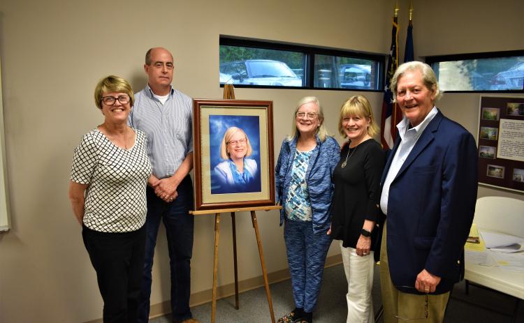 L-R: Glada Horvat, Richard Sanders, Emily Gunnells, Gail Gunnells and Walter Gordon stand alongside the newly unveiled portrait of Emily Gunnells, which will hang in a place of prominence in the Hart County Adult Learning Center.