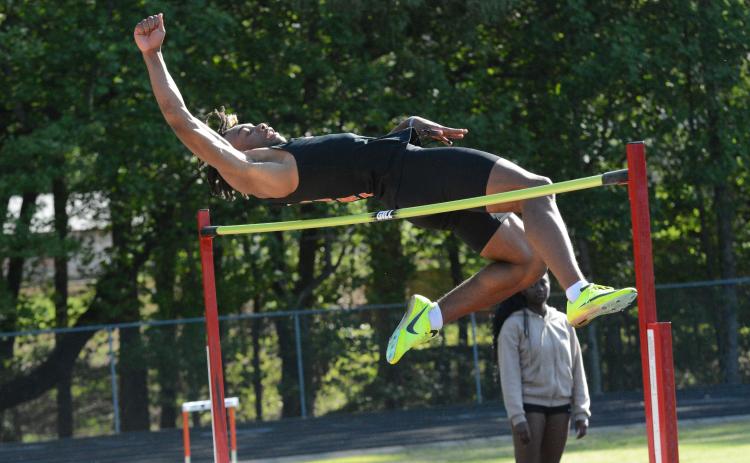 Junior Jashon Gaines advances to sectionals in the boys high jump after placing third and in the boys long jump after placing first in the GHSA Region 8-AAA meet on April 24.