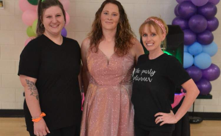 Pictured during the ‘Pumped Up Kicks’ dance and shoe drive at North Hart Elementary School are event planners and organizers (L-R) Jessica Caparas, Elizabeth Rossi and Amber Palmer. The event gave dozens of shoes to local kids.