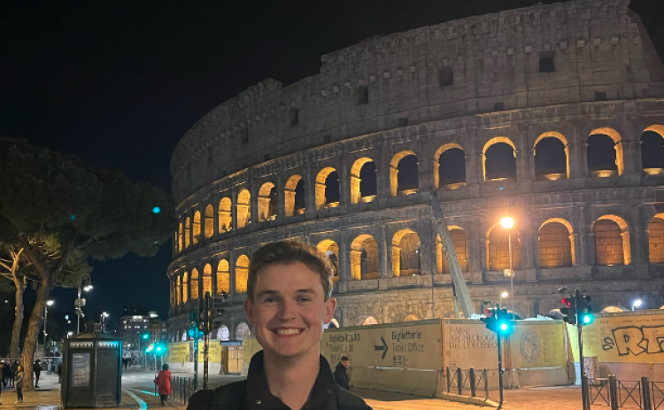 Dawson Baker stands in front of the Colosseum in Rome, Italy during Easter weekend. The Colosseum was constructed during the first century A.D.