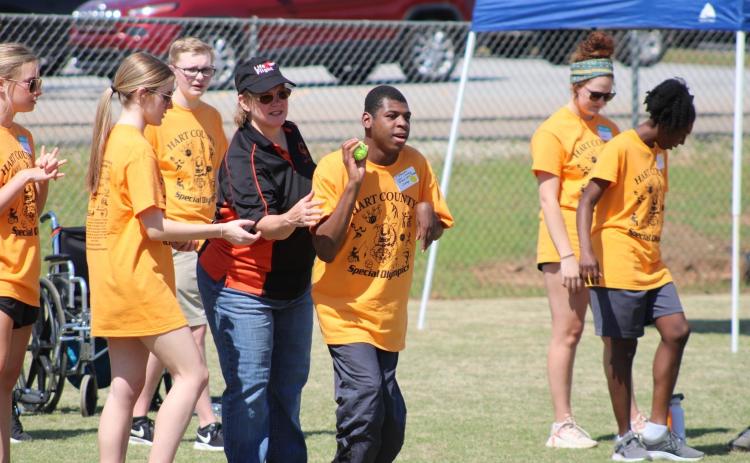 Pictured are athletes and volunteers at the 2023 Hart County Special Olympics on April 21. Pictured at the top is Addison Krause, Lyra Osborne, Hudson Milner, Noelle Reese, J’Shawn Jones, Ella Lake Carter, and Azaria Hickman helping in the shot put event.