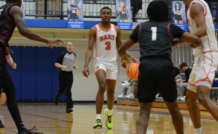 Forward Tahj Johnson (3) drives to the lane in the 47-43 win over Hebron Christian in the Region 8-AAA consolation game at Oconee County on February 17.