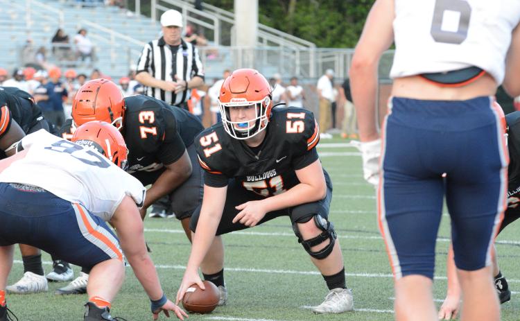 Rising junior offensive lineman Adam Broom (51) gets ready to snap the football during the 2023 spring game versus Habersham Central on Friday, May 19 from Herndon Stadium.