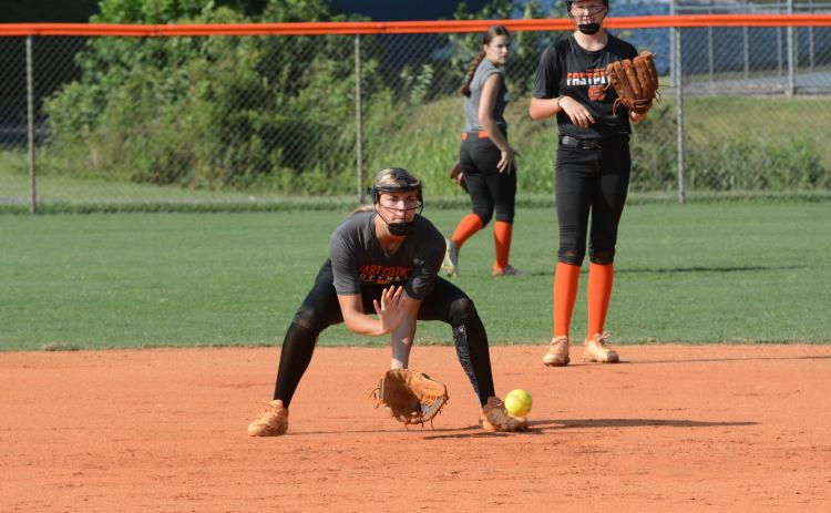 Sophomore infielder Madi Bennett grounds a hard hit ball to second base during a summer practice as the Lady Dogs prepare for their season opener on August 5 at Gainesville.