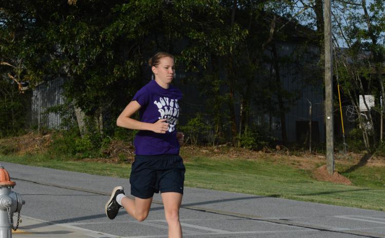 Senior runner Madison McLane working on her two mile time