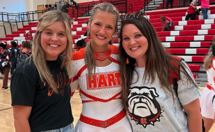 Pictured left from left to right is Hart County’s competition cheer head coach Mollie Payne, Amelia Johnson, and assistant coach Ashley Risner.