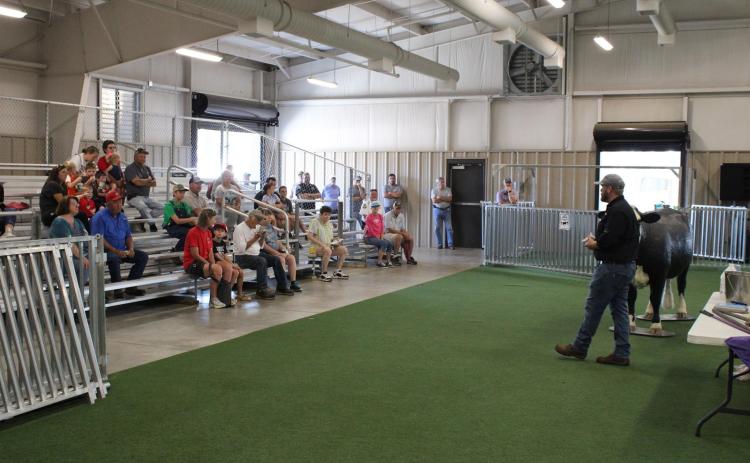 Spectators at the 2021 Northeast Georgia Ag Expo watch during the calving simulator portion of the expo at the Hart County Agriscience Center.