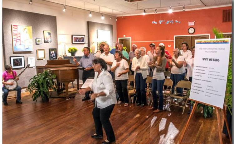 Maureen DeLoach engages the audience to sing during a performance of the Hart Area Community Chorus.