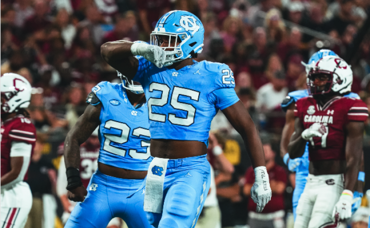 UNC defensive end Kaimon Rucker celebrates after a big time performance in the Tar Heels win over the Gamecocks of South Carolina in the Duke’s Mayo Kickoff game, 31-17. (Photo by the University of North Carolina Athletics)