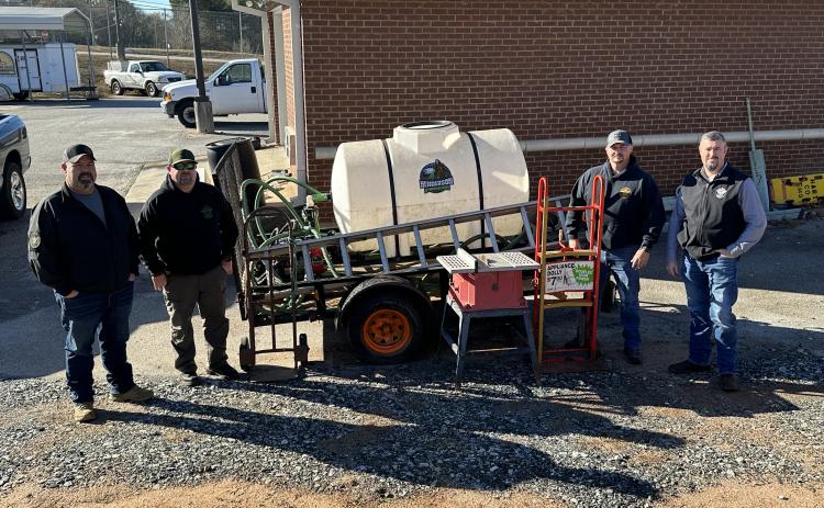 Hart County deputies pose in front of a hydroseeder seized Dec. 7.