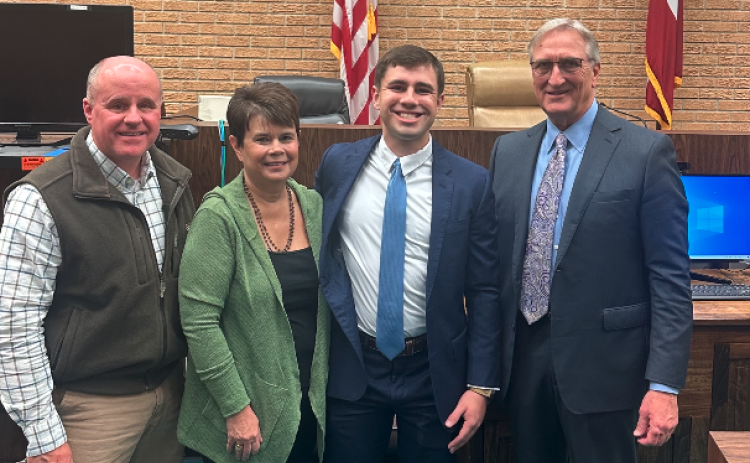 Pictured from left to right: Keith Brown (dad), Jackie Brown (mom), Nicholas Brown, and Judge Jeffery Malcom.