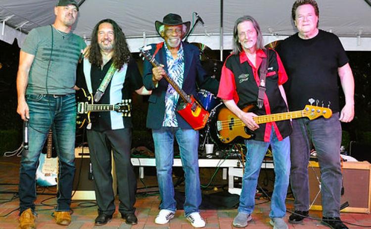 Mac Arnold (center) and his band Plate Full O’ Blues will perform at High Cotton Music Hall this Saturday.