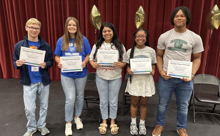 Pictured, from left to right, are Hart County High School seniors Sawyer Boyd, Gracie Cook, Kerrigan Johnson, Au’Brionna McIntosh, and Micah Reese who participated in the local Georgia Future Educators Signing Day ceremony.
