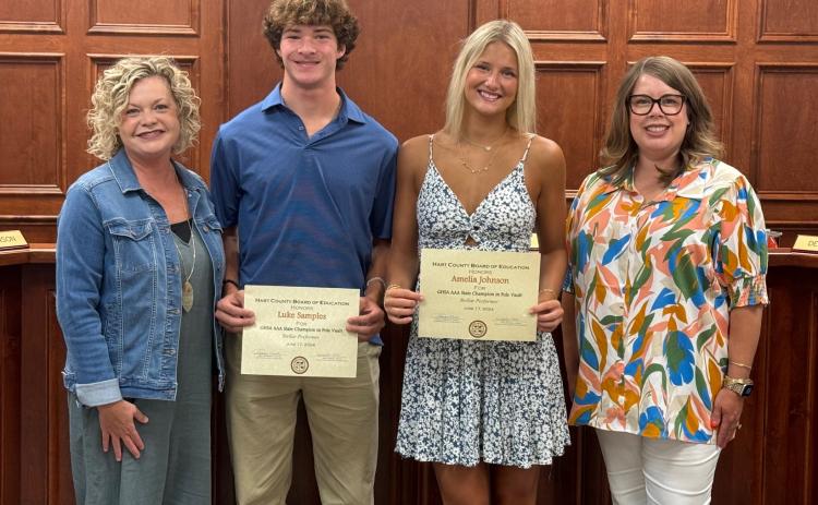 The Board of Education recognized Hart County High School track and field athletes Amelia Johnson and Luke Samples who both won state championships in the pole vault competition. Pictured above: Superintendent Jennifer Carter, Luke Samples, Amelia Johnson, and Board Chair Kim Pierce.