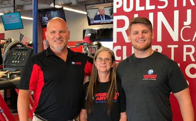 From left to right: Bill, Sheri, and Bret Cesak at one of Workout Anytime’s locations.