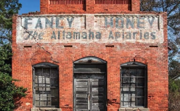 One of the most-photographed landmarks in Wayne County is the 124-year-old brick building in Gardi. Around 1940, Troy Fore Sr. purchased the iconic structure in which he operated The Altamaha Apiaries. In 1969 his son, Troy Jr., established Fore’s Honey Farms. Troy became an influential leader in the beekeeping industry.