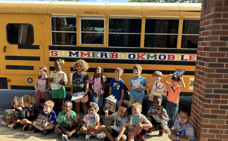 The 2024 summer bookmobile presented by Hart Partners makes a stop at a local elementary school.