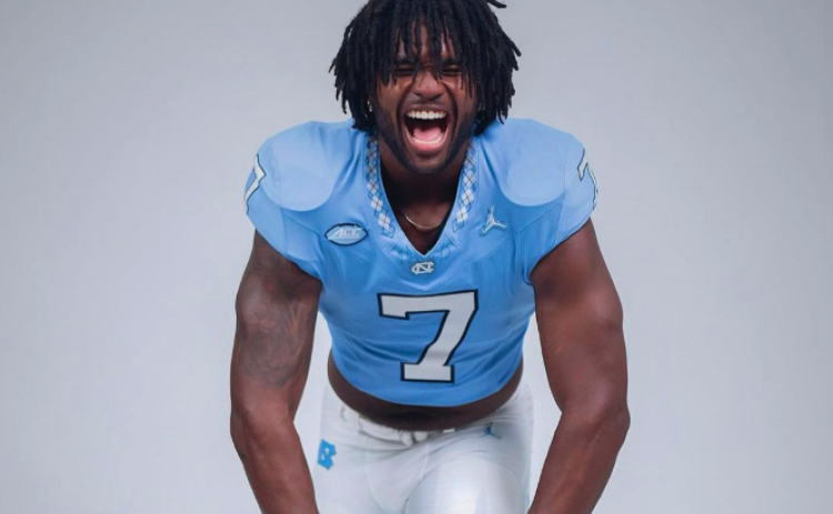 Fifth-year senior defensive end, Kaimon Rucker, poses during media day.