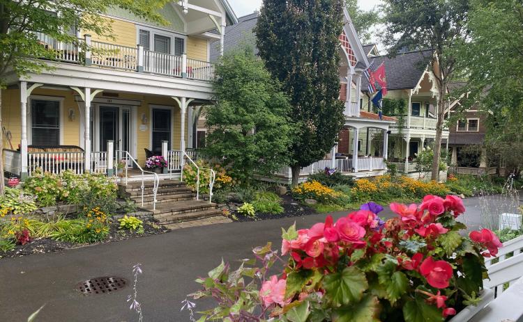 Porches are a prominent feature of homes in Chautauqua. As you walk the tree-lined paths through neighborhoods, you hear lively discussions punctuated with laughter. There is a variety of scheduled “porch chats” on specific topics, but most are impromptu visits among friends—old and new. This photo was taken from the porch of our hosts, Erroll and Elaine Davis. We met in 2008 when Gov. Sonny Perdue appointed me to the Board of Regents and Erroll was chancellor.