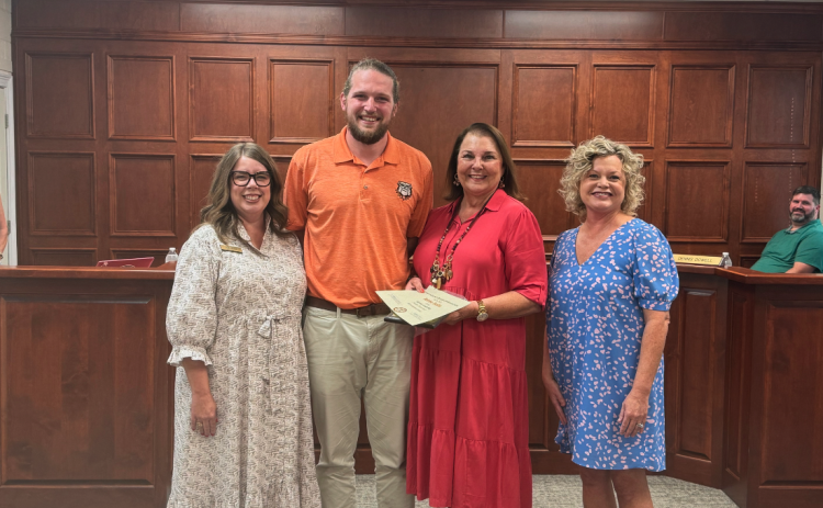 The Hart County Board of Education honored OneHartBeat Executive Director Bobbie Busha during its meeting Sept. 9. Pictured above (from left to right): Board chair Kim Pierce, Grayson Williams, Bobbie Busha, and Superintendent Jennifer Carter.