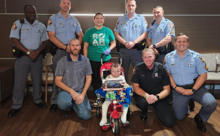 Troopers from Post 52 in Hartwell present Bennett Dornellas with a care package upon his release from the burn center in Augusta. Pictured above (from left to right) Front row: SFC Fleming, Bennett Dornellas, TFC2 Green, and SGT Dean. Back row: TFC2 Anderson, TFC1 Pratz, Chelsea Oliver [Benett’s Mother], CPL Andrews, and CPL Gandy.