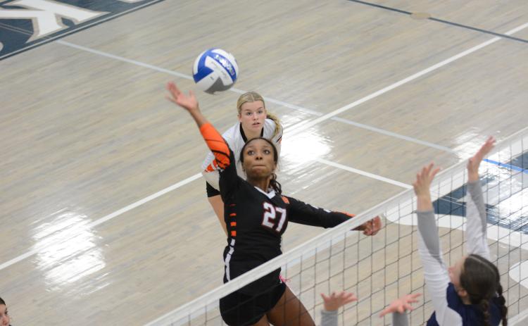 Freshman Trinity Freeman goes for the kill in the 2-0 loss to East Jackson, 21-25 and 20-25, on Sept. 24.
