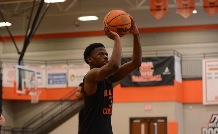Senior guard Andrew Maxwell during a shooting drill during practice on Oct. 24.