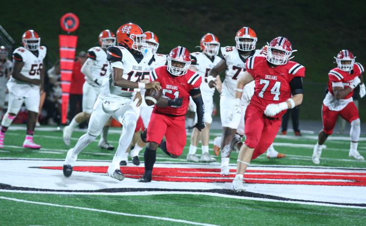 Hart County’s sophomore quarterback Kurston Curry (left) looks to evade the pressure by the Indians defenders in the 37-34 loss to Stephens County on the road on Oct. 25. Photo by Laura Shaw/The Toccoa Record.