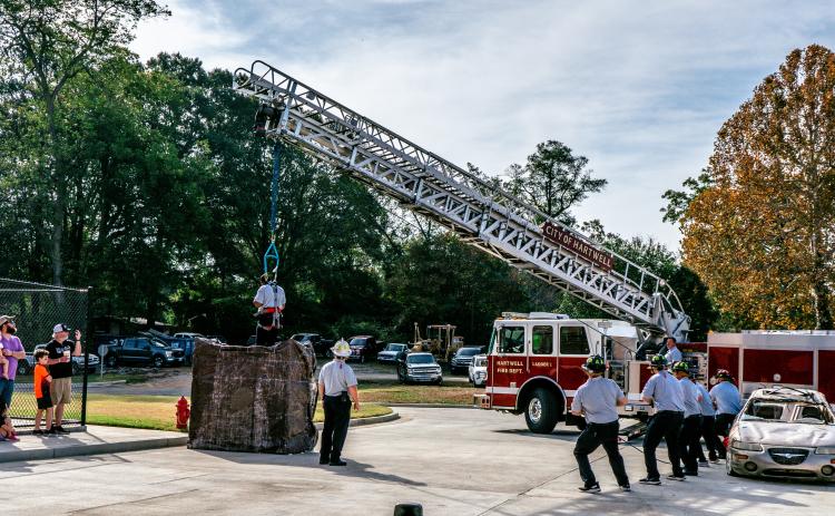 Hartwell firefighters demonstrate a confined space rescue during the grand opening of the city’s new fire station on Nov. 2.