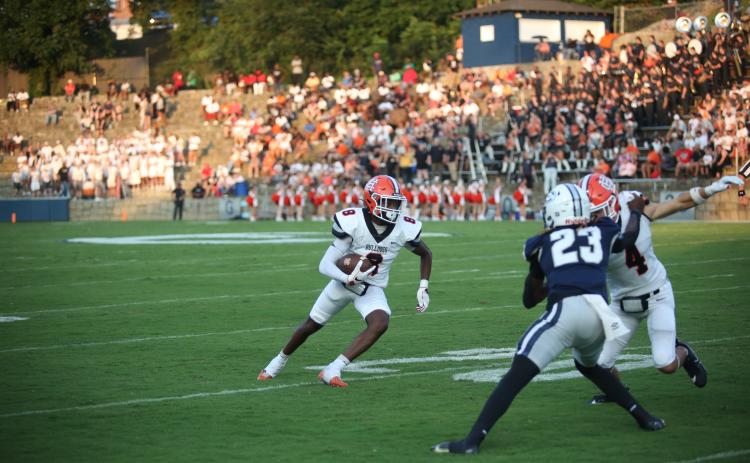 Junior wide receiver CJ Cowins turns up the field after making the catch in the 17-7 win over Elbert County on Aug. 16. Photo by Mark Wells/The Elberton Star