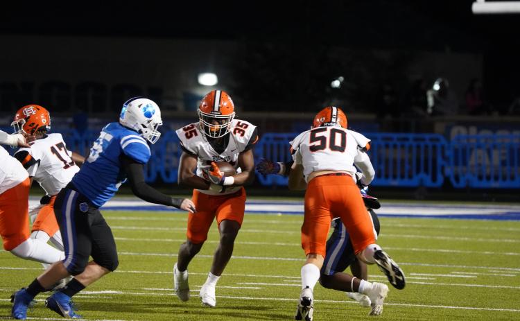 Bulldogs’ sophomore running back Faustino Rangel rushes for only 12 yards on six carries in the 19-0 shutout loss to the Ringgold Tigers in the first round of the state playoffs Nov. 15. Photo by Greg Gaines.